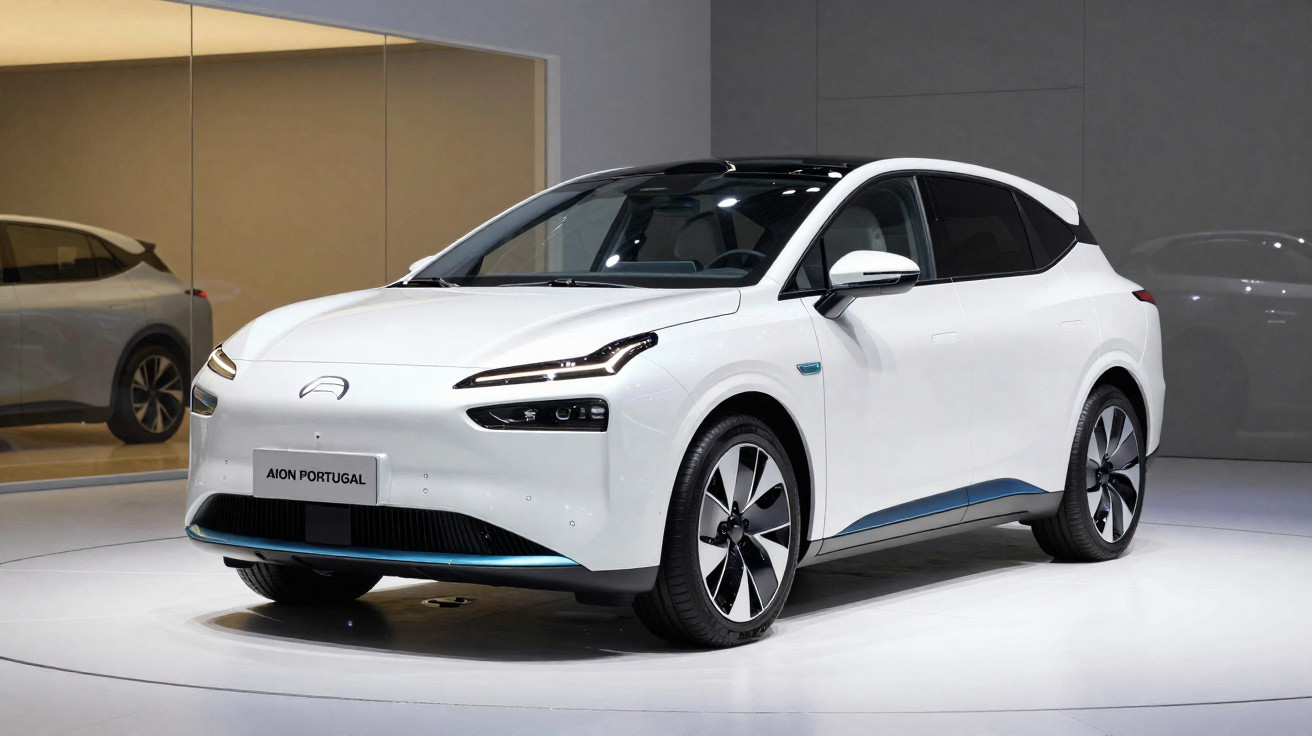 White Aion Portugal electric car displayed in a showroom with sleek, modern design and black roof accents.