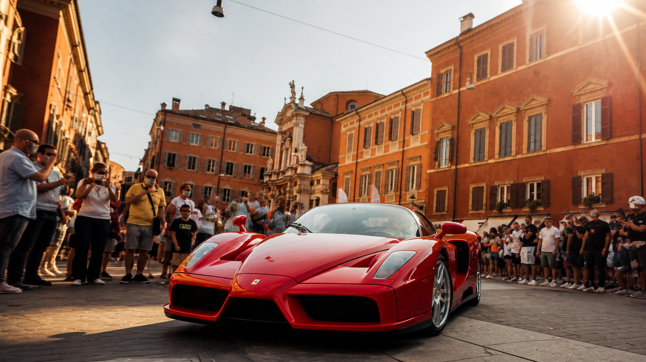 Red Ferrari sports car on a cobblestone street with a crowd and historic buildings at sunset.